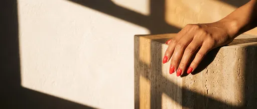 Coral Almond Nails on Travertine Stone