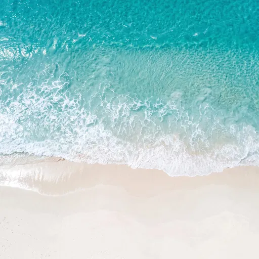 Aerial View of Turquoise Ocean and Beach