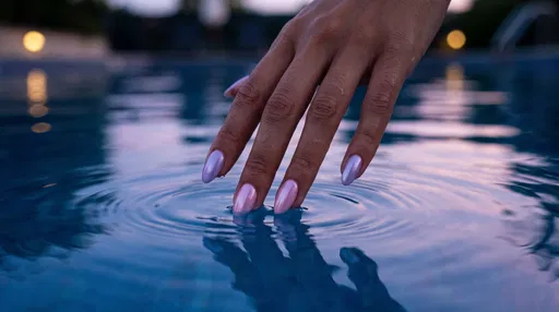 Pastel Chrome Nails Touching Twilight Pool