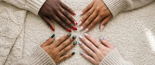 Diverse Hands Showing Winter Nail Art Designs