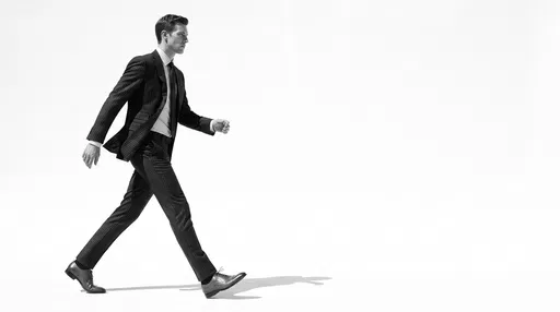 Businessman Striding Across White Studio Background