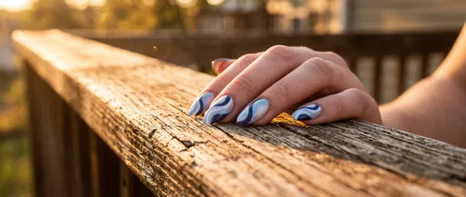 Blue Swirl Nail Art at Sunset