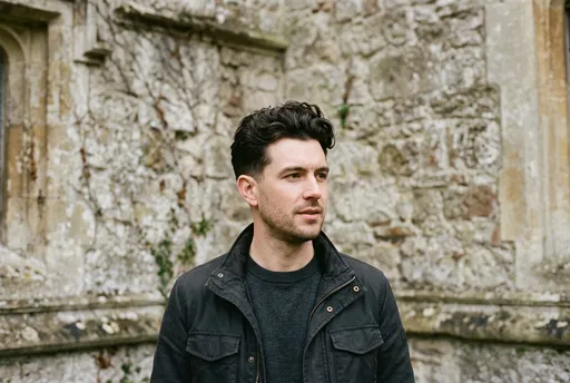 Man With Dark Wavy Hair Outdoors
