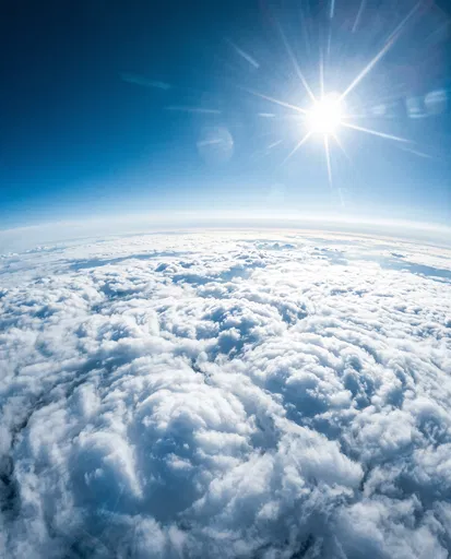 Aerial View of Sun Over Clouds