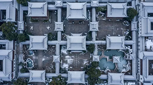 Aerial View of Snowy Chinese Courtyard Roofs
