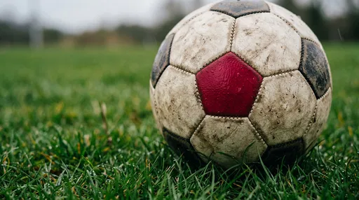 Weathered Soccer Ball With Red Pentagon