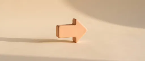 Matte Peach Ceramic Arrow on Cream Surface