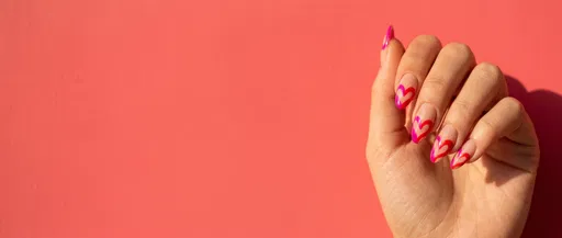 Woman's Hand With Heart Nail Art