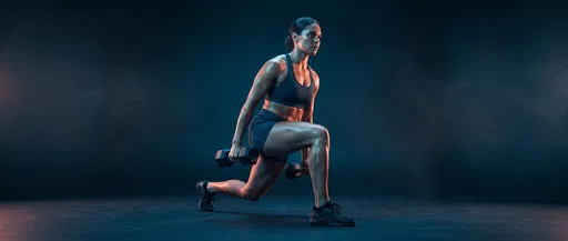 Athletic Woman Performing Dumbbell Lunge