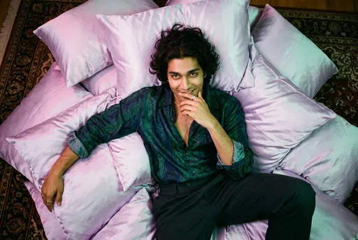 Overhead Portrait of Man on Satin Pillows