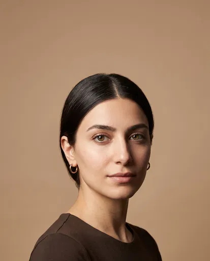 Studio Portrait of Woman on Beige Background