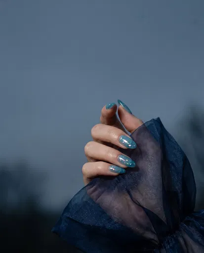 Hand With Blue Jelly Almond Nails