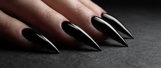 Close-Up of Glossy Black Stiletto Nails