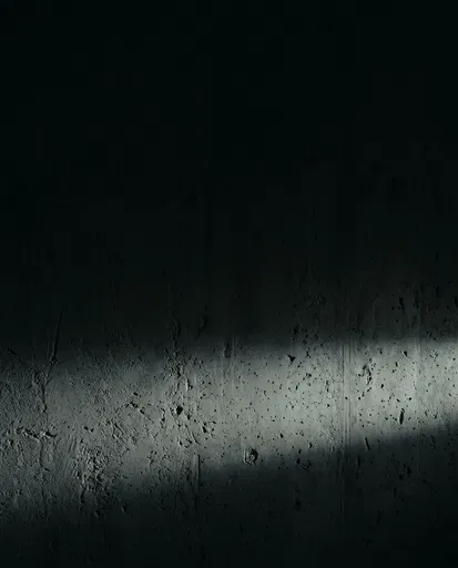 Dark Textured Concrete Wall With Light Shaft