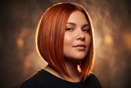 Woman With Copper Red A-Line Bob