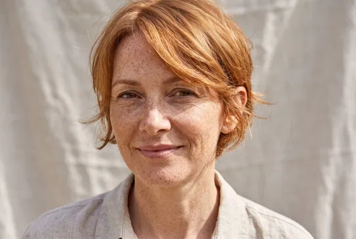 Freckled Woman With Ginger Pixie Cut