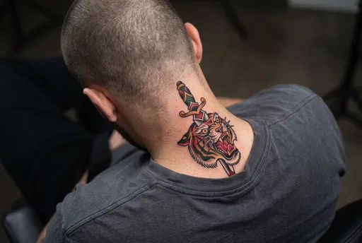 Man With Traditional Tiger Neck Tattoo