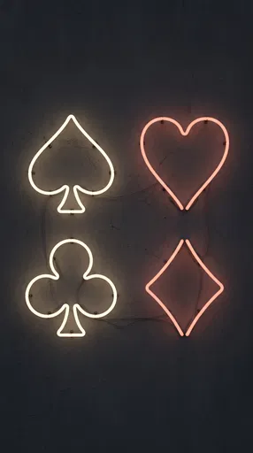 Neon Playing Card Suits on Dark Wall
