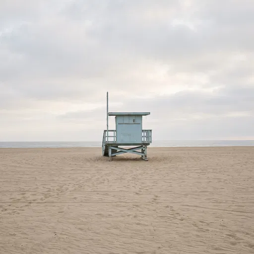 Pale Blue Lifeguard Tower on Overcast Beach