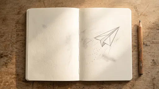 Paper Airplane Sketch in Open Notebook