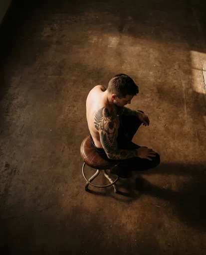 Overhead View of Man With Botanical Tattoo