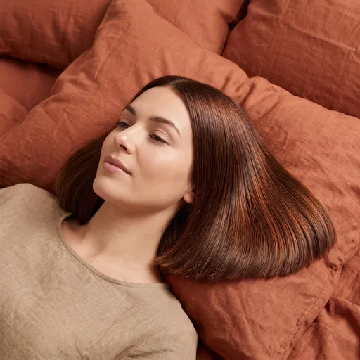 Woman With Chestnut Bob on Terracotta Linen