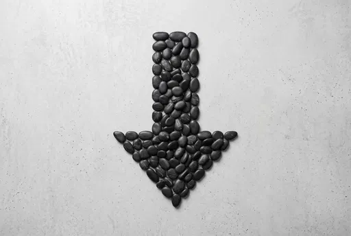 Black Pebble Downward Arrow on Concrete