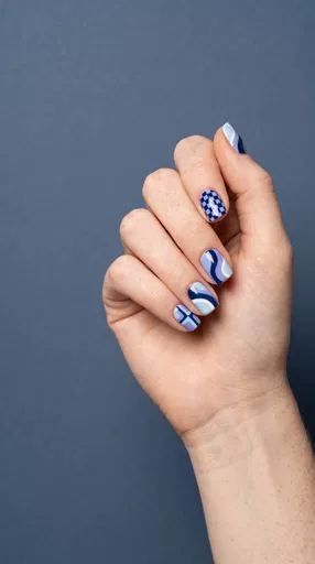 Hand With Blue Graphic Nail Art