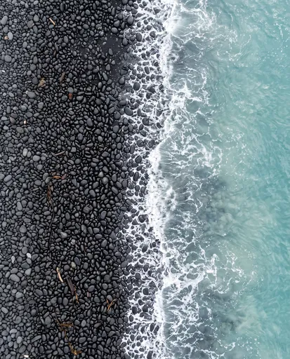 Top-Down Black Pebble Beach and Waves