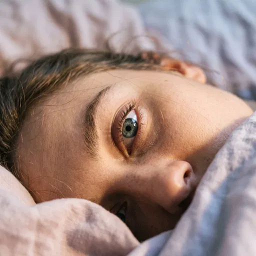 Close-Up of Grey Eye in Bed