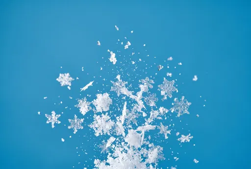 Upward Burst of Crystalline Snowflakes on Blue