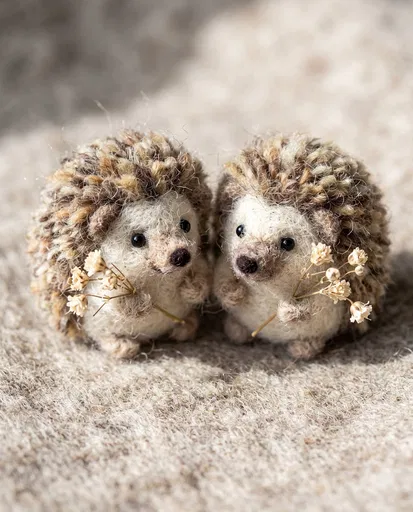 Two Needle-Felted Wool Hedgehogs With Flowers