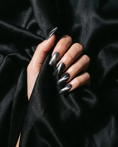 Hand With Silver Cat's Eye Nails