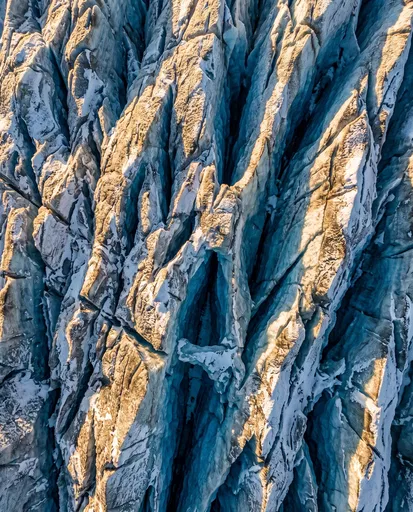 Aerial View of Fractured Glacier Crevasses