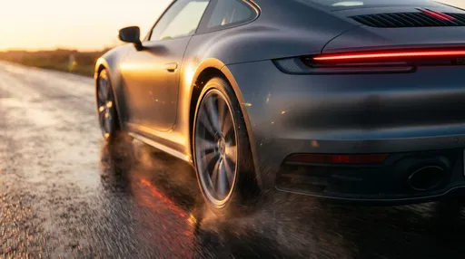 Matte Grey Sports Car Driving at Sunset