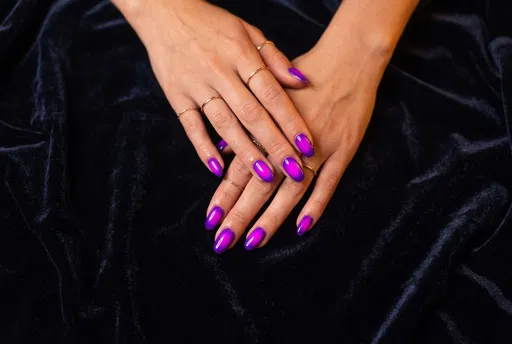 Hands With Neon Purple Aura Nails