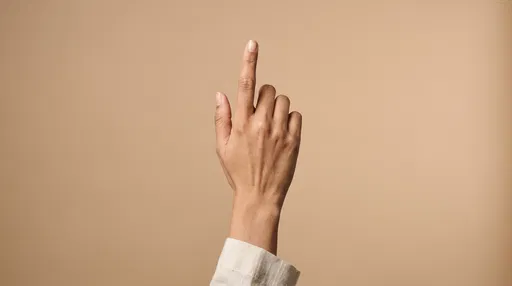 Woman's Hand Pointing Index Finger Up