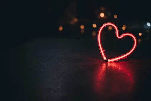 Glowing Red Neon Heart at Night