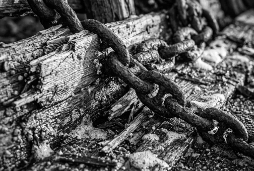Monochrome Rusted Chain on Shipwreck Wood