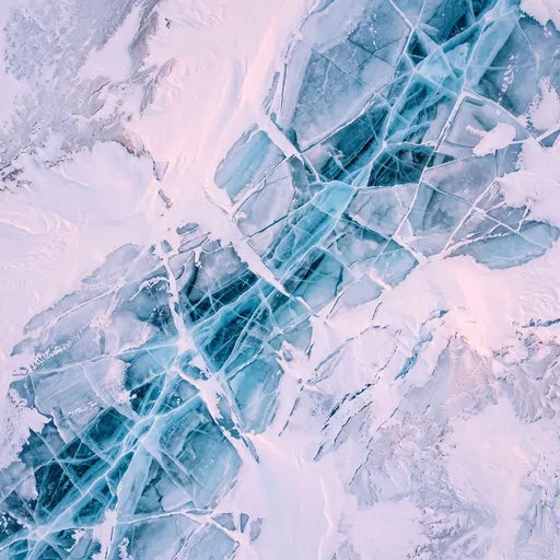 Aerial View of Cracked Blue Glacial Ice