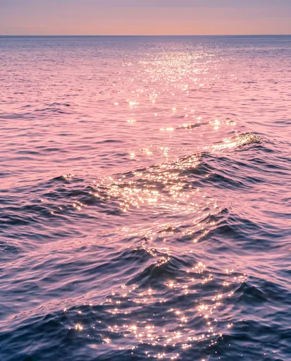 Sparkling Pink Ocean Waves at Sunset