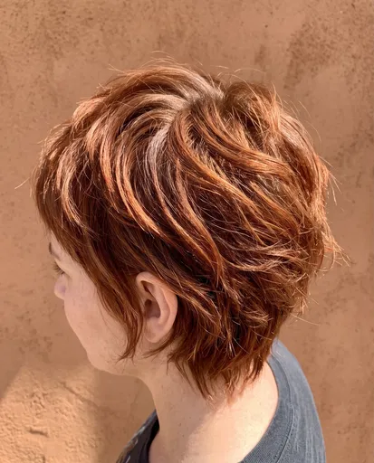 Side Profile of Auburn Pixie Haircut