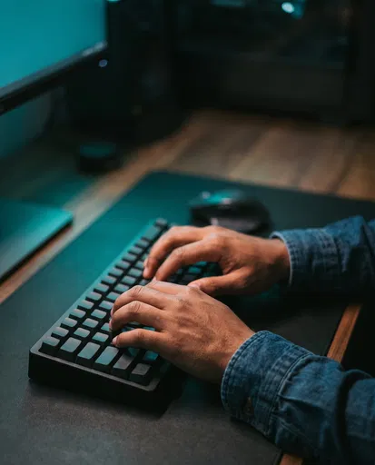 Hands Typing on Blank Mechanical Keyboard