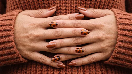 Hands with Tortoiseshell Autumn Almond Manicure