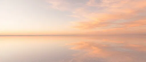 Pastel Orange Sunset Over Reflective Salt Flat