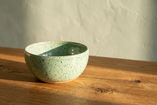 Speckled Mint Ceramic Bowl on Wood