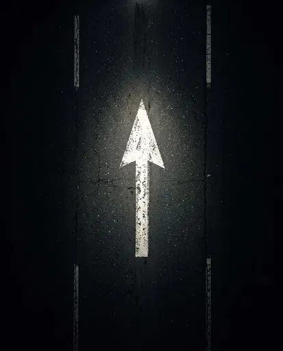 White Traffic Arrow on Dark Asphalt
