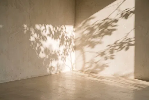 Sunlight and Leaf Shadows on Beige Corner