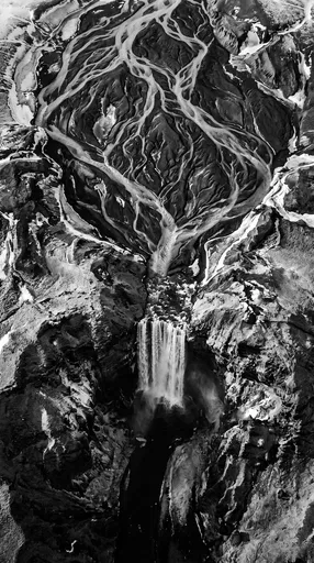Monochrome Aerial View of Glacial Waterfall