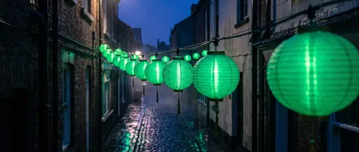 Glowing Green Lanterns in Cobblestone Alley